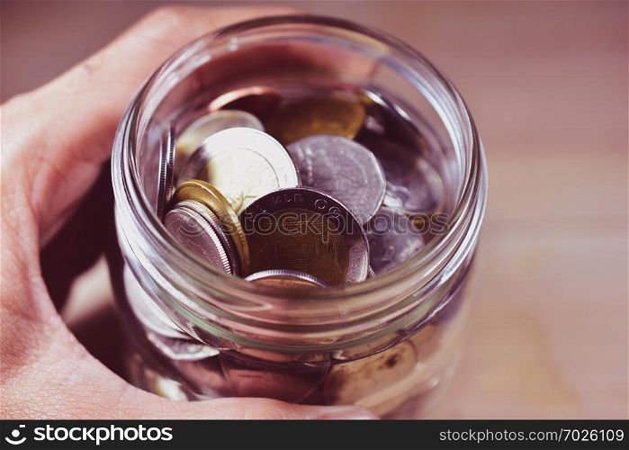 Thai baht coins in jar