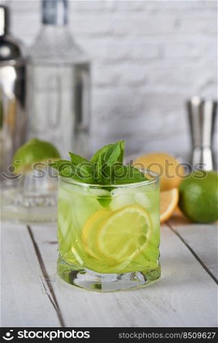 Thai basil smash cocktail   and lemon. Refreshing organic gin drink.