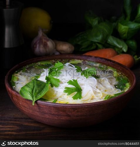 Thai chicken noodle soup, dark moody still life