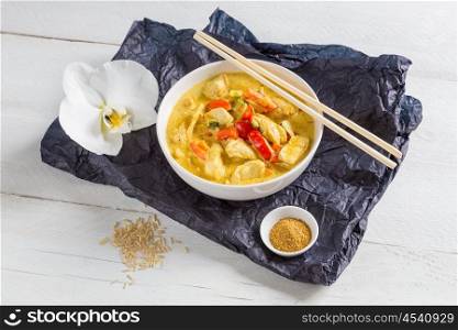 Thai Curry in a bowl on wood.. Thai Curry in a bowl on wood