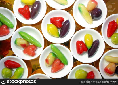 thai dessert, deletable imitation fruits in small dish on buffet line
