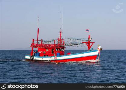 Thai fishing boat under way in the sea off Trang, Thailand