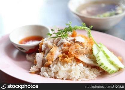 Thai food gourmet fried chicken with rice , khao mun kai tod in wood background