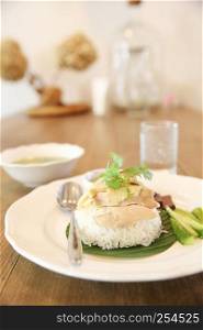 Thai food gourmet steamed chicken with rice , khao mun kai in wood background