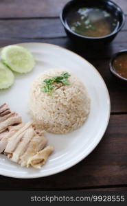 Thai food gourmet steamed chicken with rice khao mun kai in wood background 