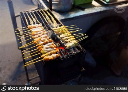 THAI FOOD , Pork Satay on stove .