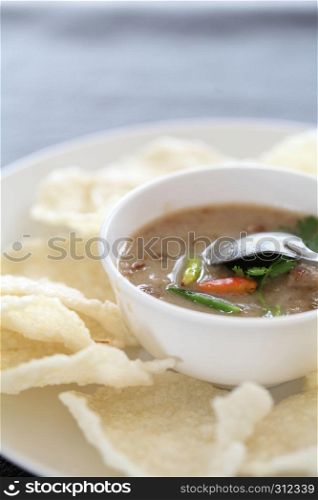 Thai food rice crust with pork white sauce