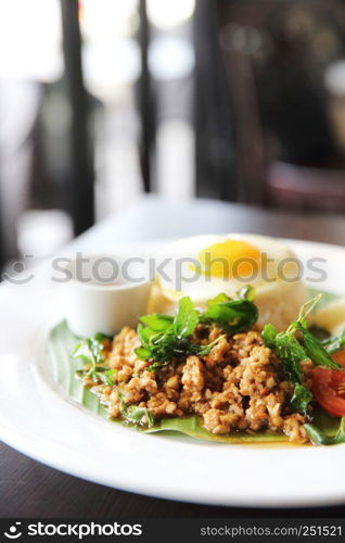 Thai food Rice topped with stir fried pork and basil