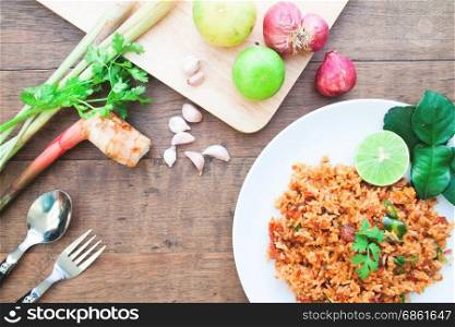 Thai food spicy fried rice with ingredients on wood table, Overhead view shot