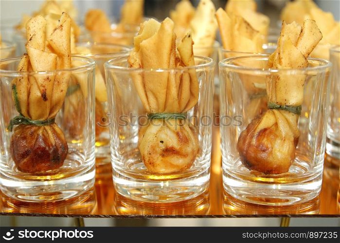 thai food toong tong , traditional appetisers in small glass on buffet line