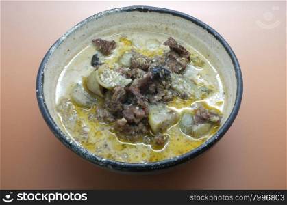 Thai green curry soup with beef and coconut milk
