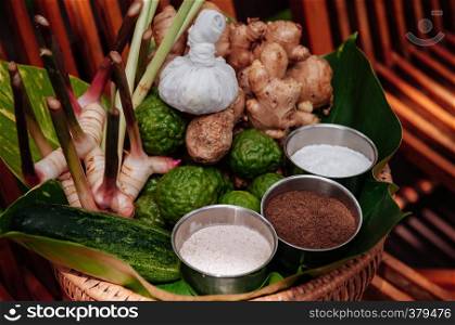 Thai herbs spa treatment ingredients and scrub with galangal, ginger, bergamot, grinded coffee, spa salt and cucumber