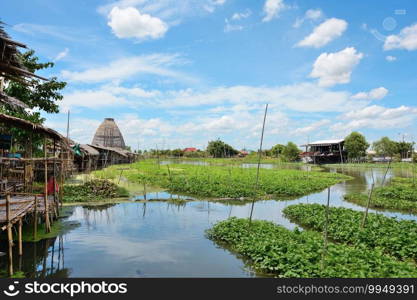Thai market on the edge of the canal with sky as background