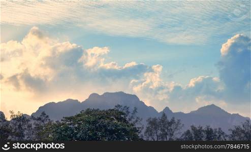 thai mountains under cloudy sky, early morning