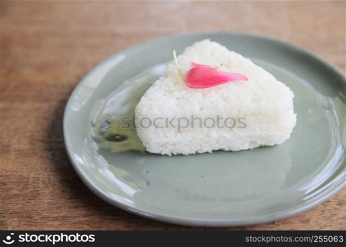 Thai rice on wood background