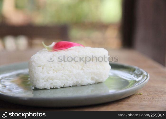 Thai rice on wood background