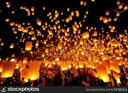 Thai's Family release sky lanterns to worship buddha's relics in yi peng festival, Chiangmai thailand