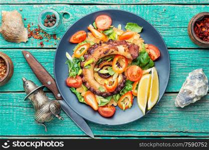 Thai salad with grilled octopus and fresh vegetables.Fresh healthy salad. Salad with vegetables and octopus
