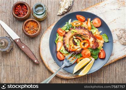 Thai salad with grilled octopus and fresh vegetables.Fresh healthy salad. Vegetable salad with octopus.