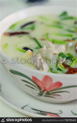 Thai soup is made with coconut milk, galangal, lemon grass, and chicken