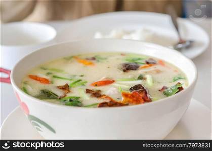 Thai spicy chicken soup in coconut milk ,mushrooms, intensely flavor of galangal, lemongrass, kaffir lime leaf, cilantro
