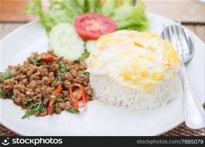 Thai spicy food basil pork fried rice with fried egg, stock photo