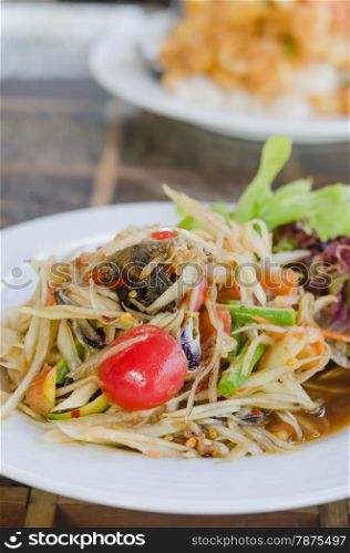 Thai spicy papaya salad. Thai spicy papaya salad serve with vegetables