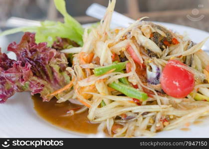 Thai spicy papaya salad. Thai spicy papaya salad serve with vegetables