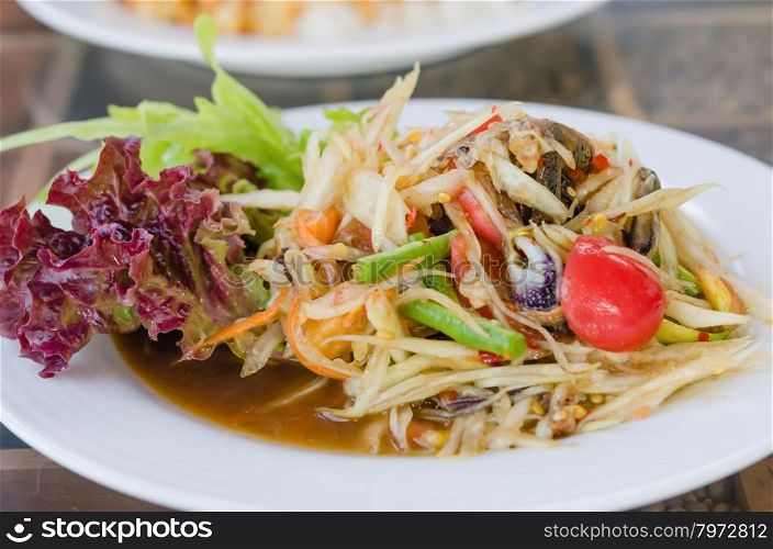 Thai spicy papaya salad. Thai spicy papaya salad serve with vegetables
