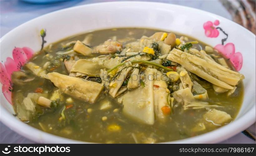Thai spicy soup with bamboo shoots and herbs , Thai rustic style food