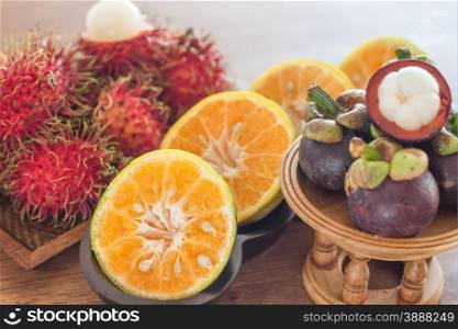 Thai tropical fruit on wooden table, stock photo