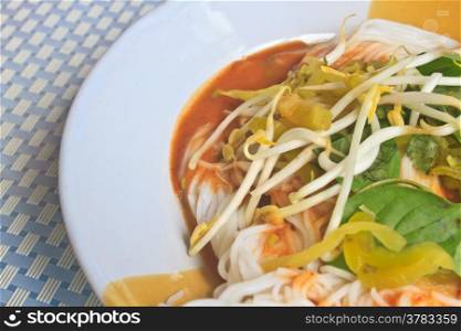 Thai vermicelli eaten with curry and vegetable close up