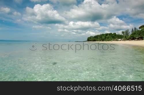 Thailand island beach with clear waves