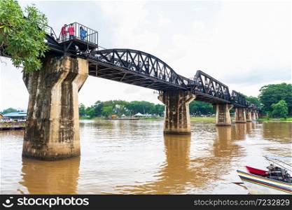 Thailand, Kanchanaburi - October 6, 2019: Tourist visit The Bridge of the River Kwai is a history of world war ii, the death railway bridge over Kwai river built by Japanese soldiers, Kanchanaburi, Thailand.