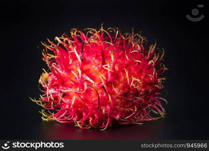 Thailand rambutan fruits black background.