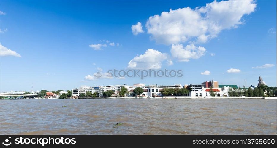 Thammasat University is near river.cloud and sky in day time.