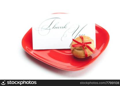 thank you card,cake nut and ribbon isolated on white