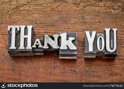 thank you - words in vintage metal type printing blocks over grunge wood, mixed fonts in style and size
