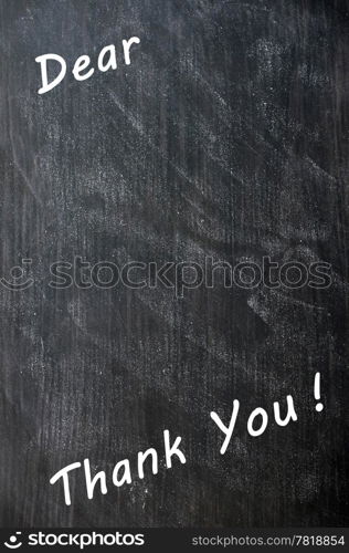 Thank you written with chalk on a smudged blackboard with copy space for extra text