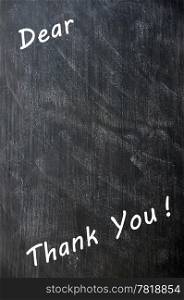 Thank you written with chalk on a smudged blackboard with copy space for extra text