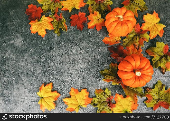 Thanksgiving background frame autumn leaf decoration festive on dark plate / Autumn table setting with pumpkins holiday