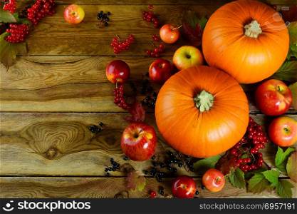 Thanksgiving background with pumpkins, berries and apples. Thanksgiving background with pumpkins, berries and apples. Thanksgiving party invitation card.