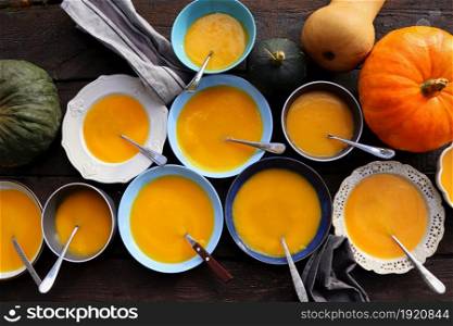 Thanksgiving concept with pumpkin, pumpkin soup .Fall table setting for celebration Autumn holiday with soup.