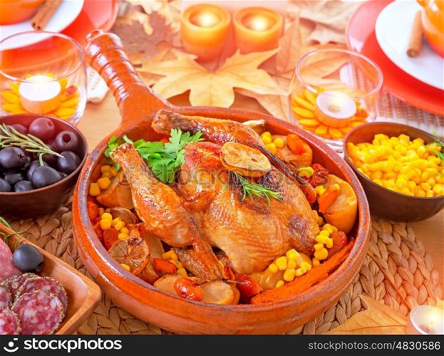 Thanksgiving day dinner, traditional festive food, tasty oven baked turkey with vegetables and lemon, beautiful decorated holiday table