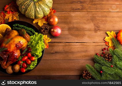 Thanksgiving roast turkey or chicken and vegetables, Top view Christmas dinner feast food decoration traditional homemade on wooden table background, Happy thanksgiving day of holiday concept