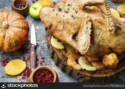 Thanksgiving table with roasted duck.Thanksgiving dinner and roasted turkey. Whole baked duck