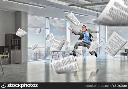 That feeling of freedom. Happy young businessman running away from office