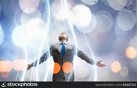 That feeling when you did it right!. Joyful businessman with outstretched arms celebrating success