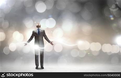 That feeling when you did it right!. Joyful businessman with outstretched arms celebrating success