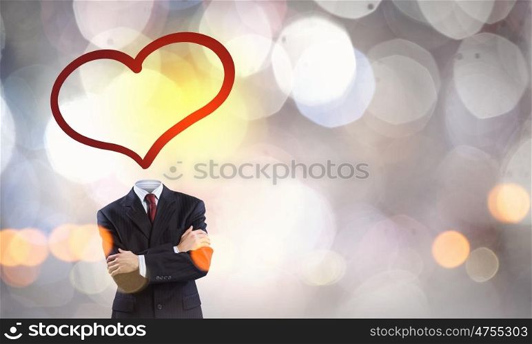 That love feeling. Faceless businessman with heart instead of head